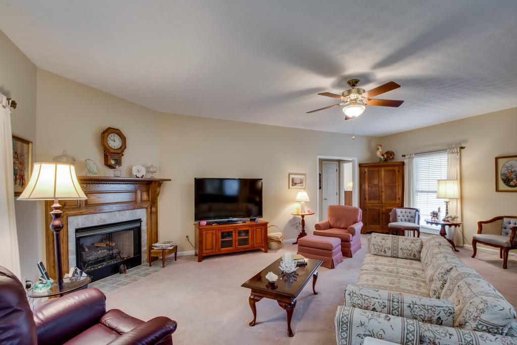 50 Beasley Bend Road Riddleton, TN 37151 - Photo 8 of 30 a living room with furniture a fireplace and a flat screen tv