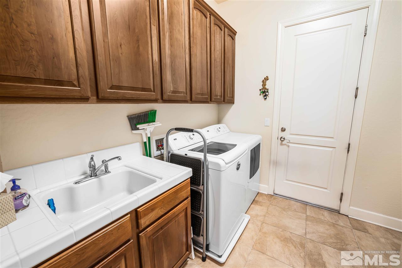 1235 Meridian Ranch Drive Reno, NV 89523 - Photo 15 of 19 a utility room with sink dryer and washer