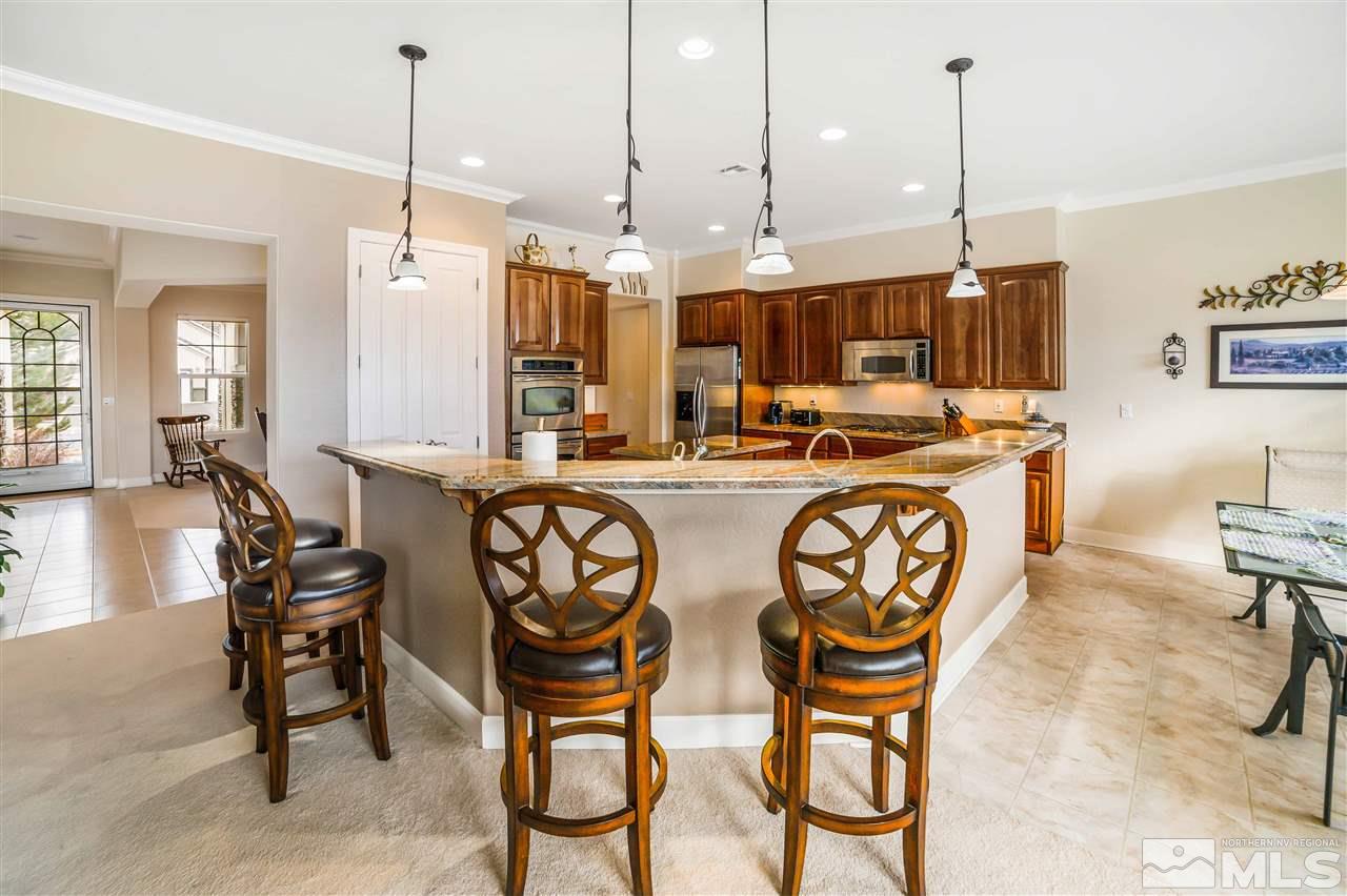 1235 Meridian Ranch Drive Reno, NV 89523 - Photo 5 of 19 a view of a dining room and livingroom with furniture wooden floor a chandelier