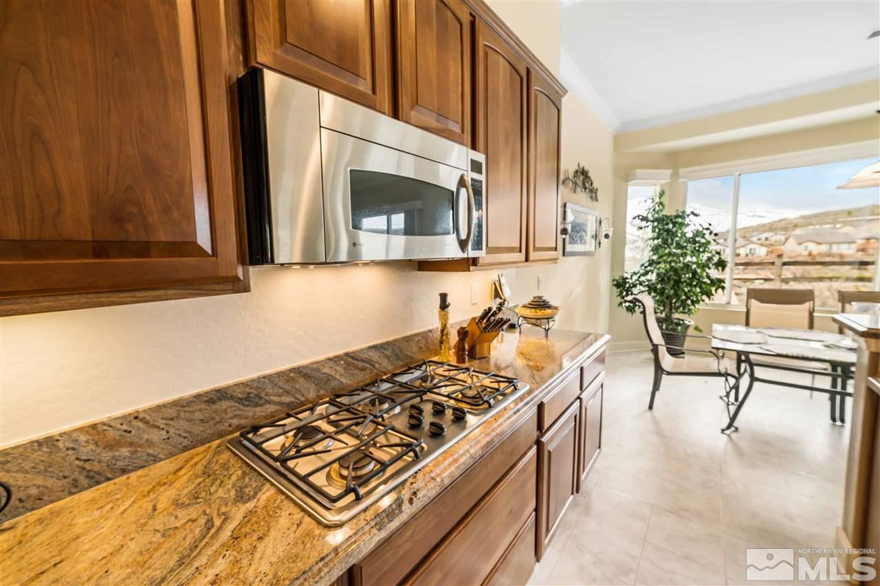 1235 Meridian Ranch Drive Reno, NV 89523 - Photo 8 of 19 a kitchen with a stove a sink and a microwave