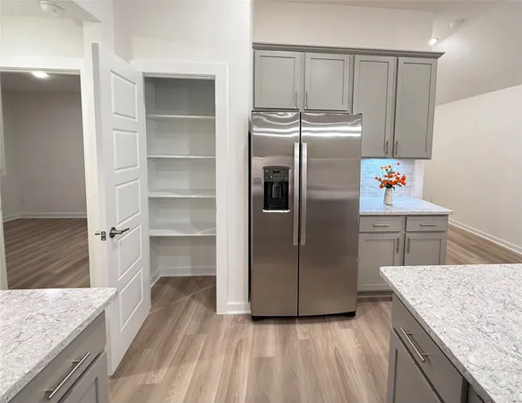 a stove top oven sitting inside of a kitchen