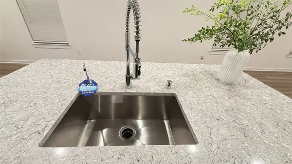 a view of a livingroom with a hardwood floor and a ceiling fan