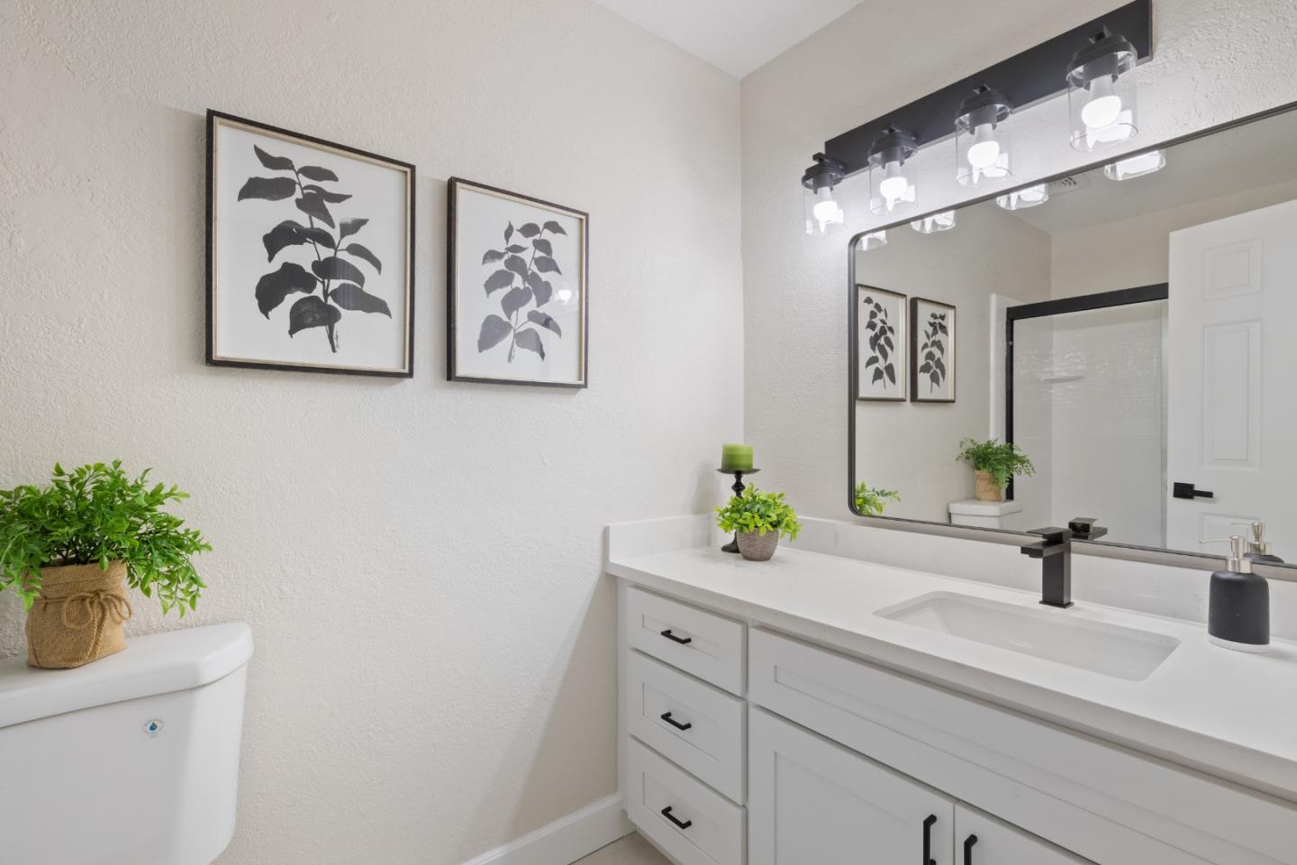 1148 Kayellen Court San Jose, CA 95125 - Photo 12 of 23 a bathroom with a sink a mirror and vanity