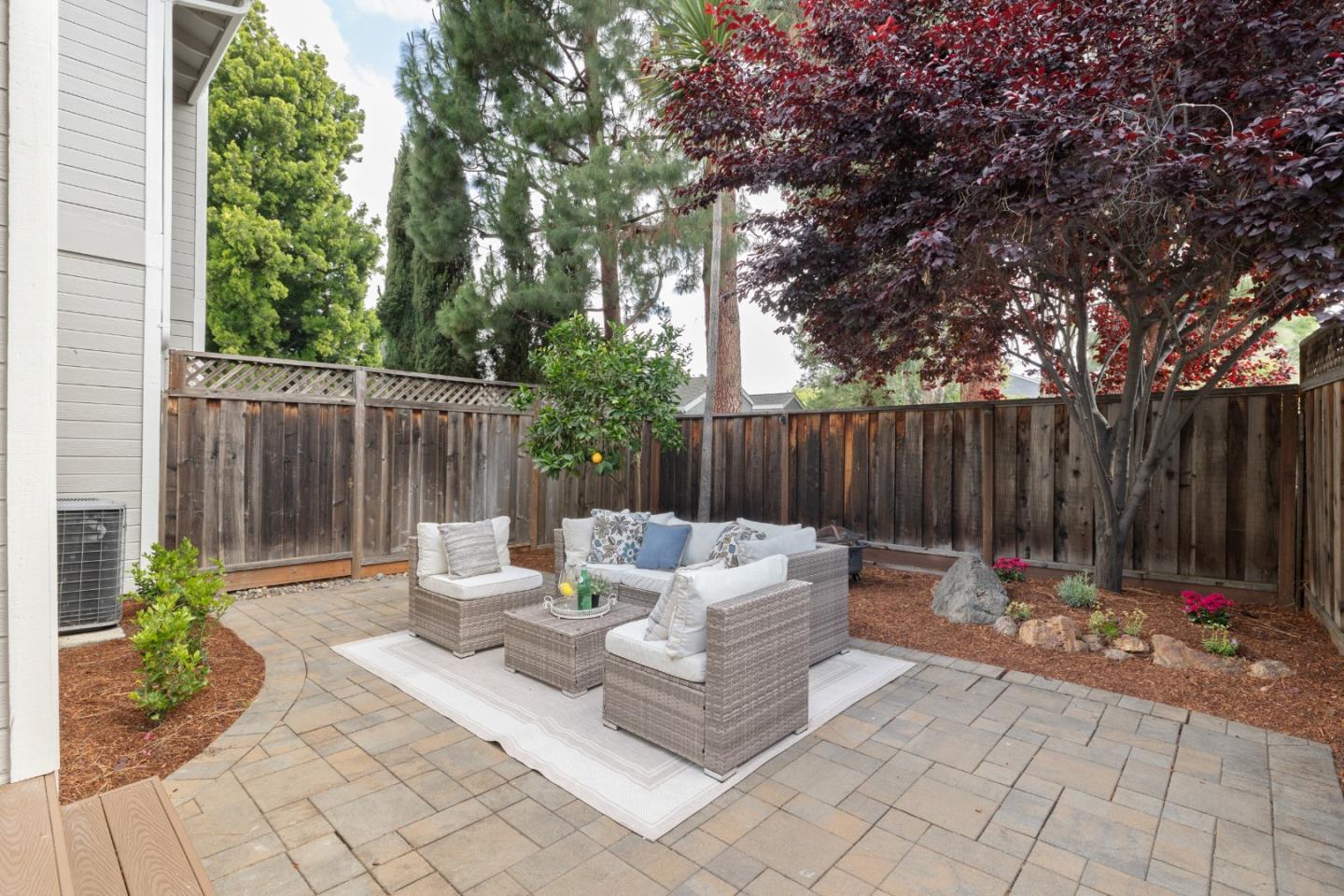 1148 Kayellen Court San Jose, CA 95125 - Photo 2 of 23 a backyard of a house with table and chairs