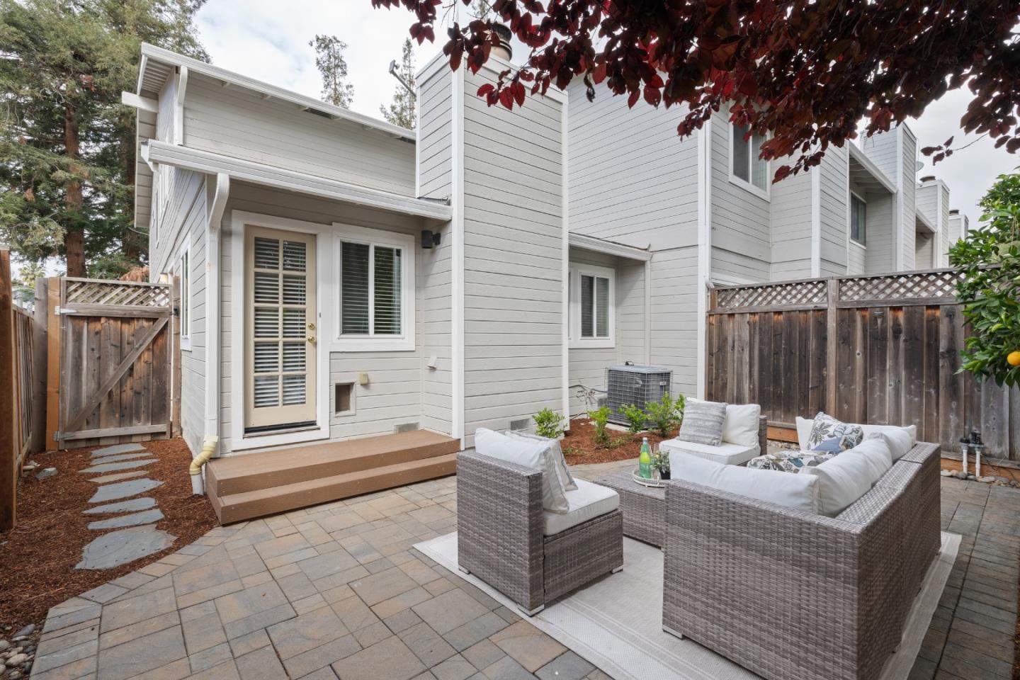 1148 Kayellen Court San Jose, CA 95125 - Photo 21 of 23 a view of a patio with couches and a fire pit and wooden fence