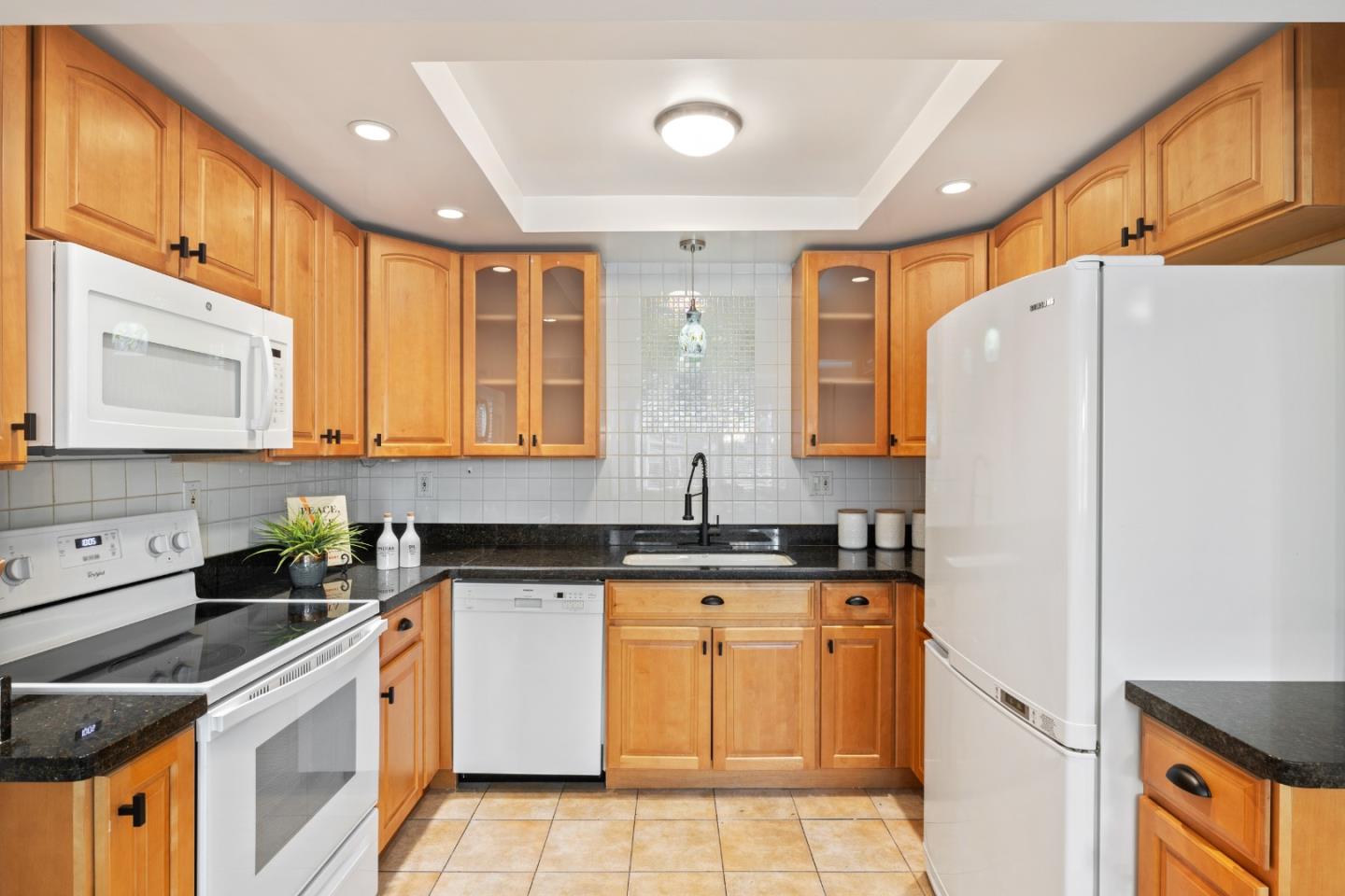 1148 Kayellen Court San Jose, CA 95125 - Photo 7 of 23 a kitchen with granite countertop a sink a counter space appliances and cabinets
