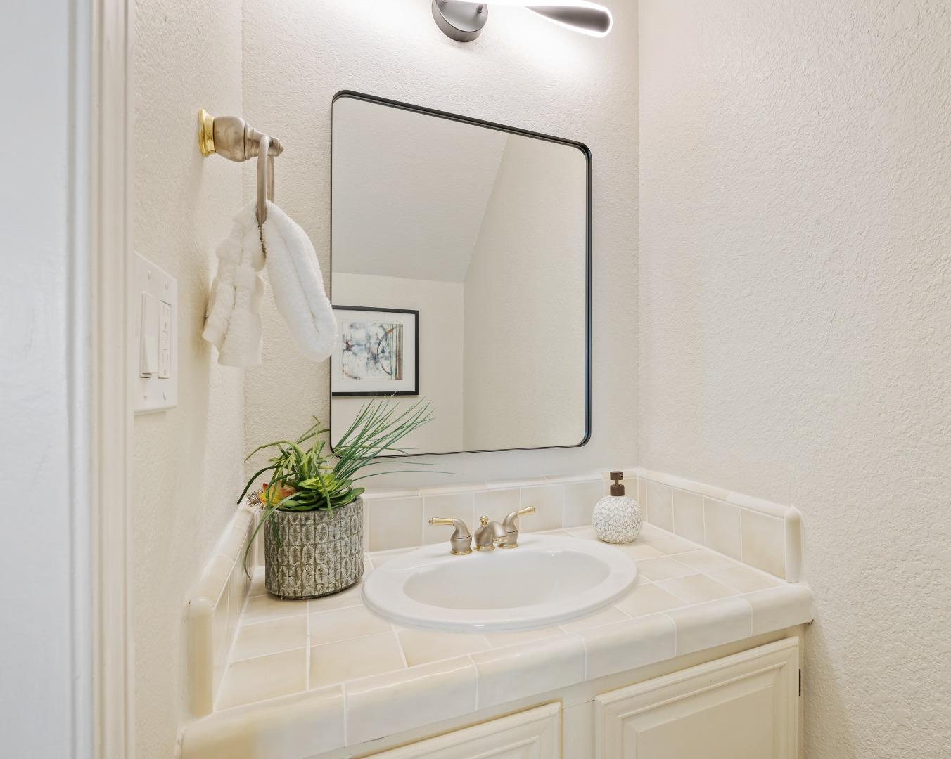1148 Kayellen Court San Jose, CA 95125 - Photo 9 of 23 a bathroom with a sink a mirror and a shower
