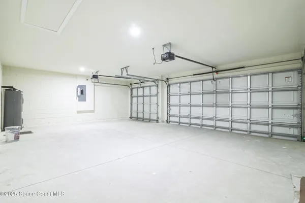 an empty room with wooden floor and window