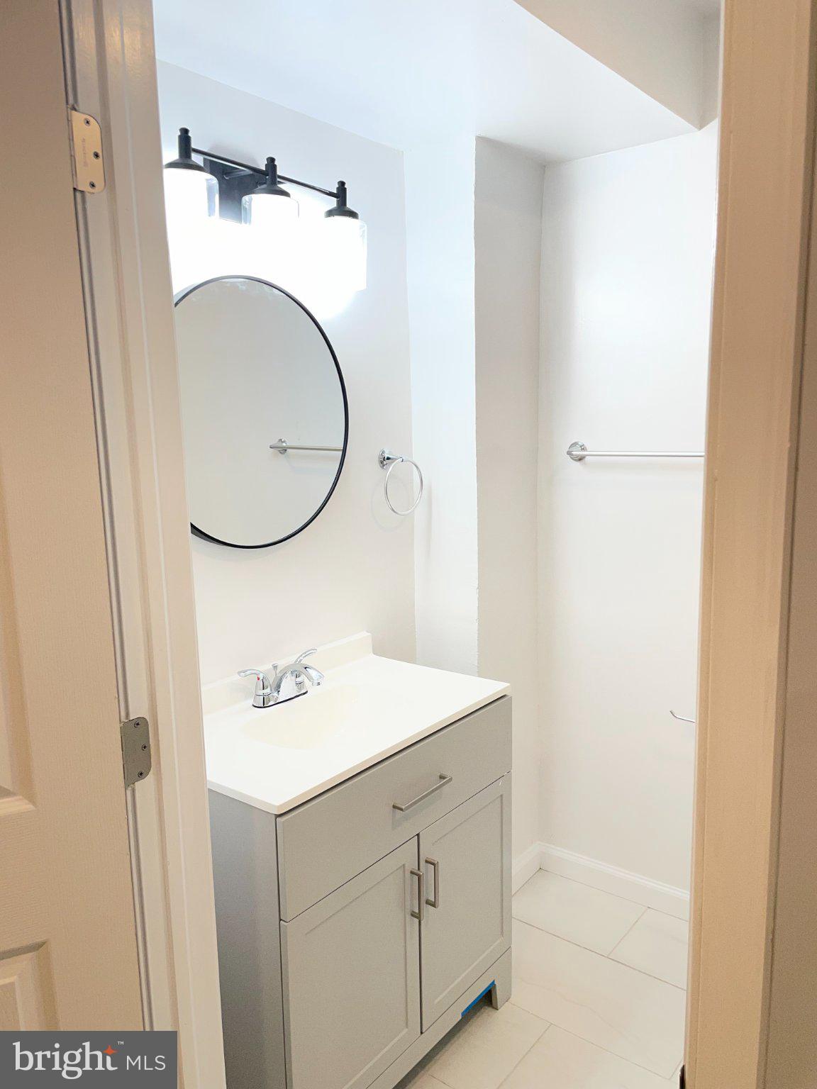 2016 Gatewood Place Silver Spring, MD 20903 - Photo 16 of 24 a bathroom with a sink and a mirror