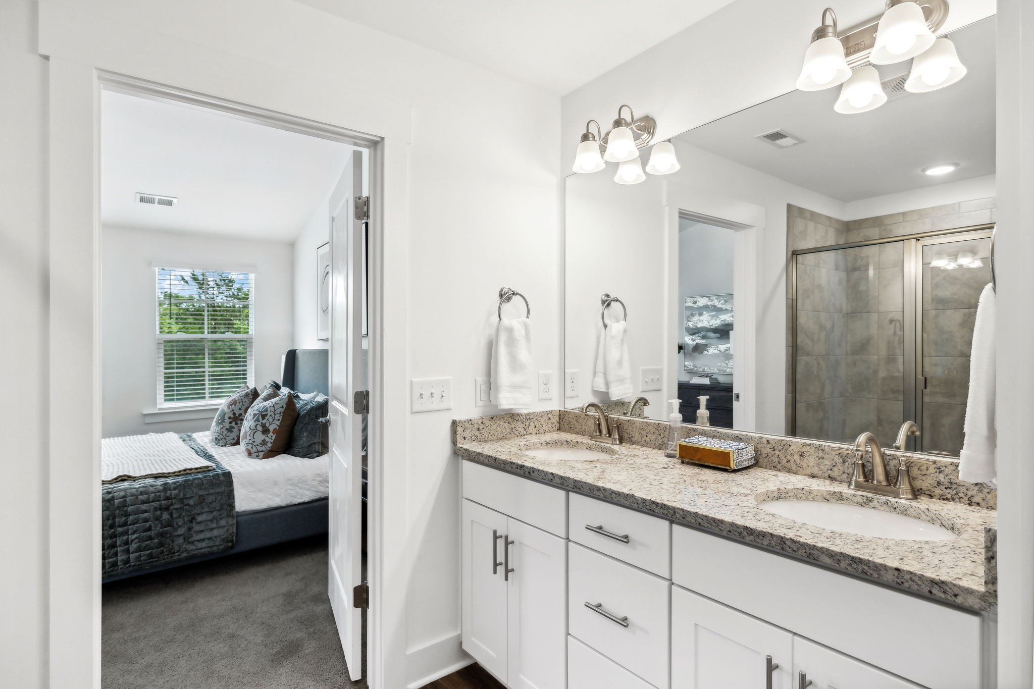 500 Black Tea Way Franklin, TN 37064 - Photo 26 of 68 a en suite spacious bathroom with a granite countertop sink a toilet a mirror and vanity