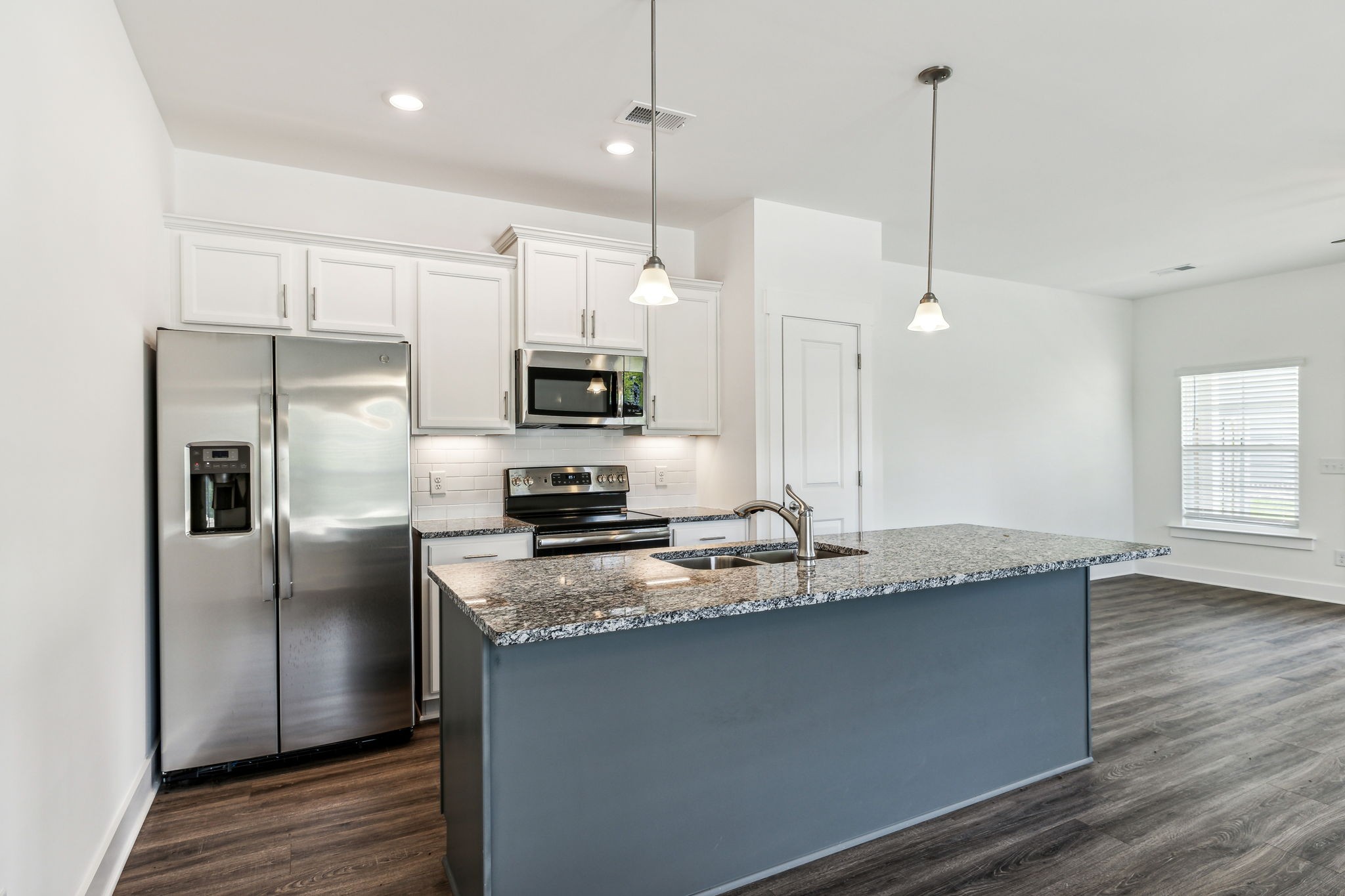 500 Black Tea Way Franklin, TN 37064 - Photo 37 of 68 a kitchen with kitchen island granite countertop a sink a counter space appliances and cabinets