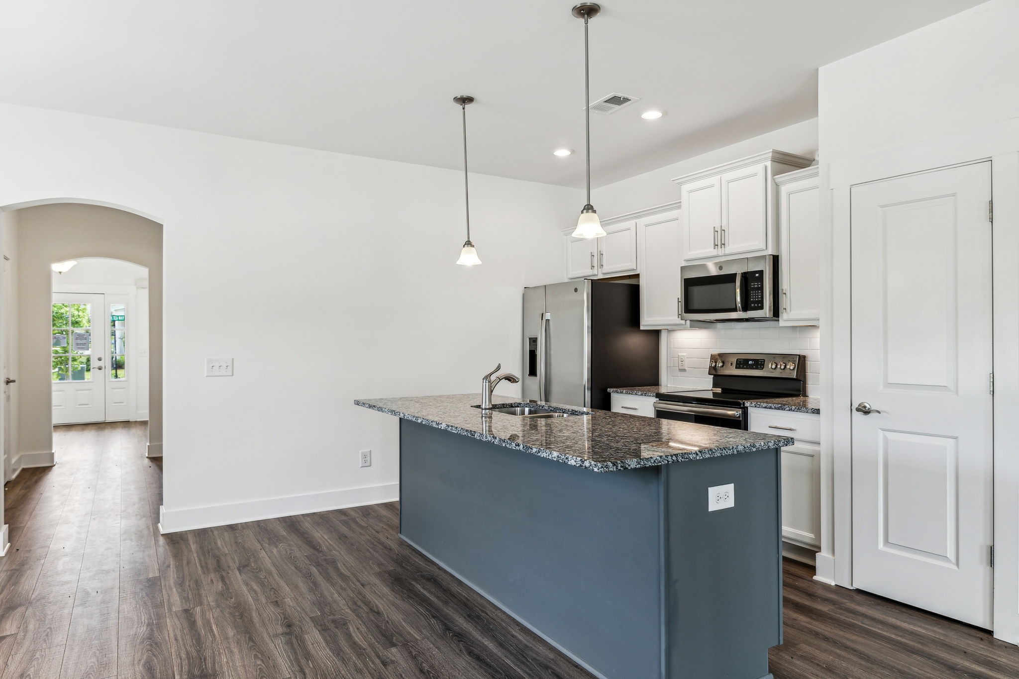 500 Black Tea Way Franklin, TN 37064 - Photo 39 of 68 a kitchen with kitchen island granite countertop stainless steel appliances and wooden floor