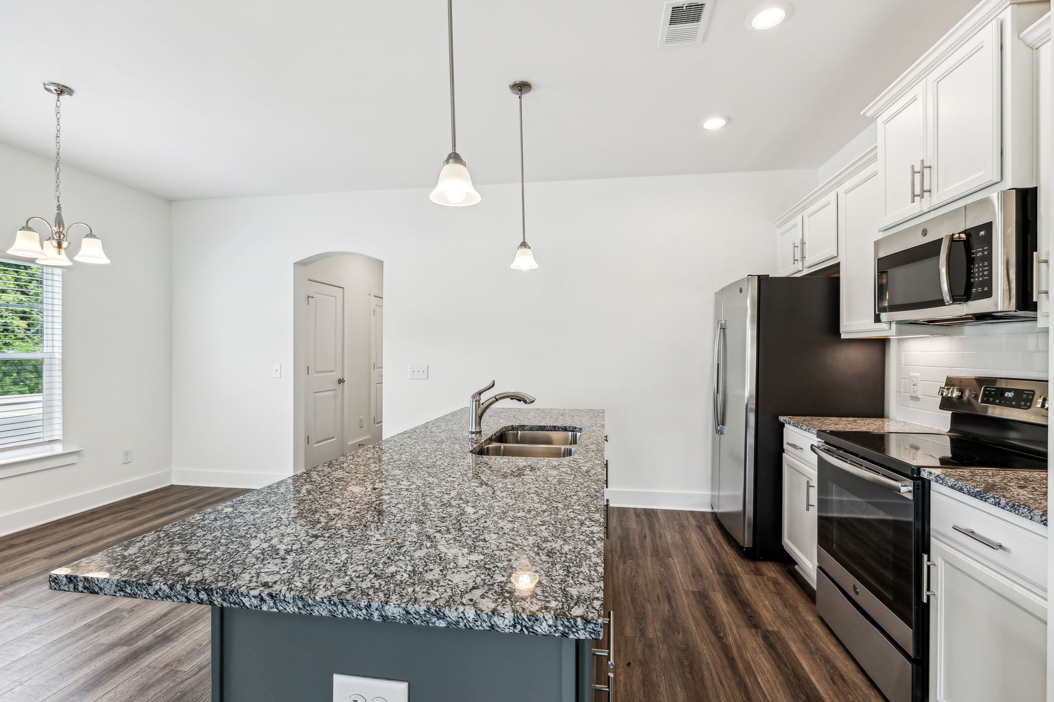 500 Black Tea Way Franklin, TN 37064 - Photo 40 of 68 a kitchen with stainless steel appliances granite countertop a refrigerator a oven and a wooden floor