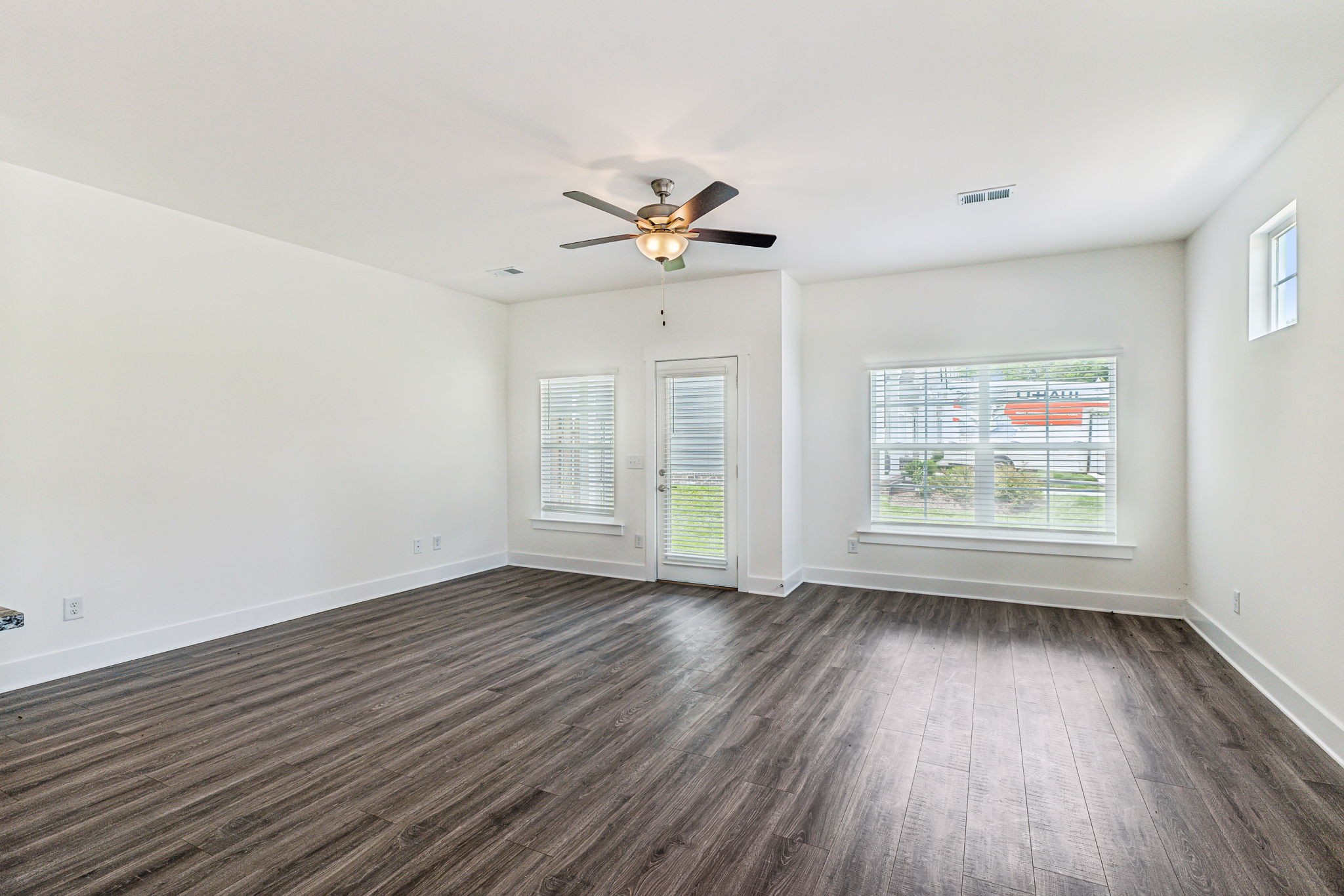 500 Black Tea Way Franklin, TN 37064 - Photo 44 of 68 an empty room with wooden floor chandelier fan and windows