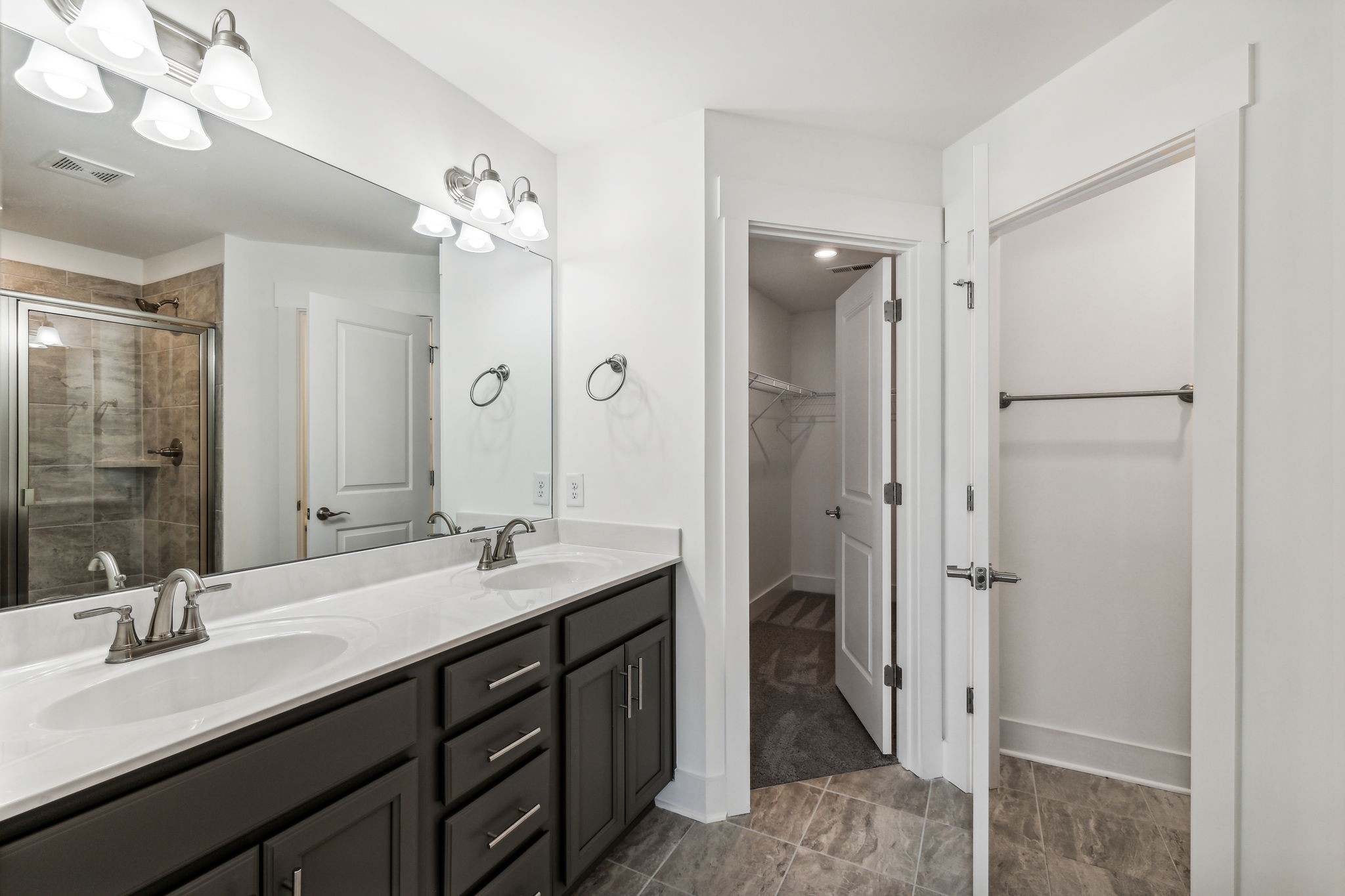 500 Black Tea Way Franklin, TN 37064 - Photo 49 of 68 a bathroom with a double vanity sink and mirror with shower