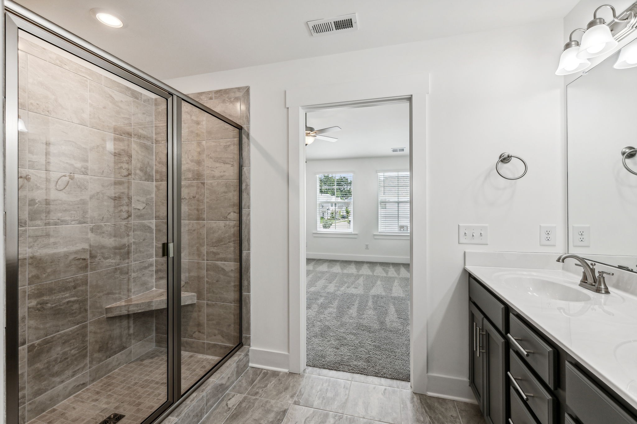 500 Black Tea Way Franklin, TN 37064 - Photo 50 of 68 a bathroom with a shower sink and mirror