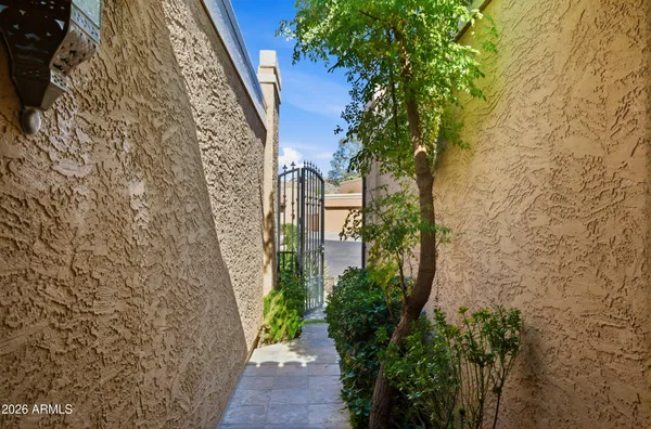 a view of a hallway with wooden floor and entryway