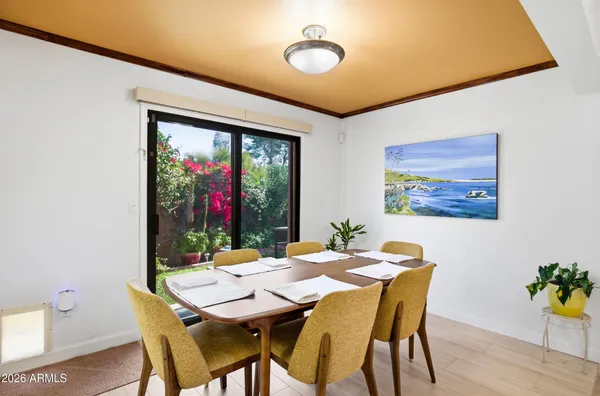 a view of a dining room with furniture and wooden floor