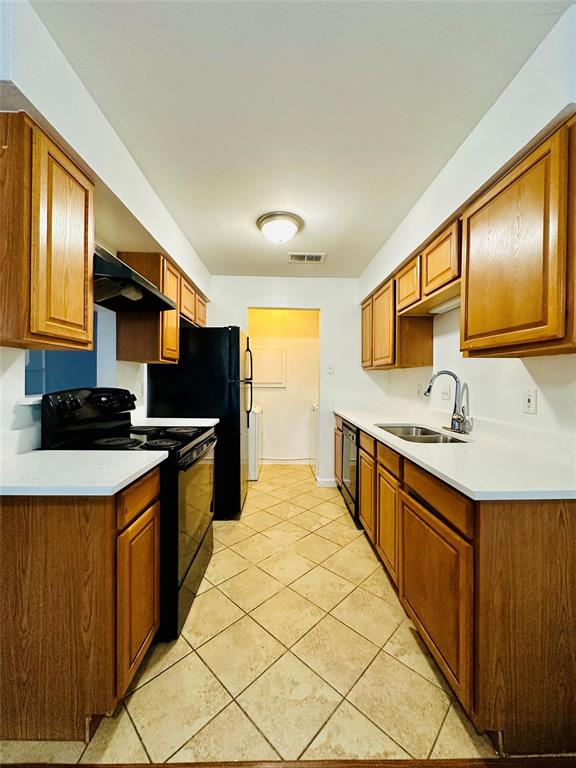 2240 Tarpley Road, Unit 234 Carrollton, TX 75006 - Photo 2 of 13 a kitchen with stainless steel appliances granite countertop a sink and a stove