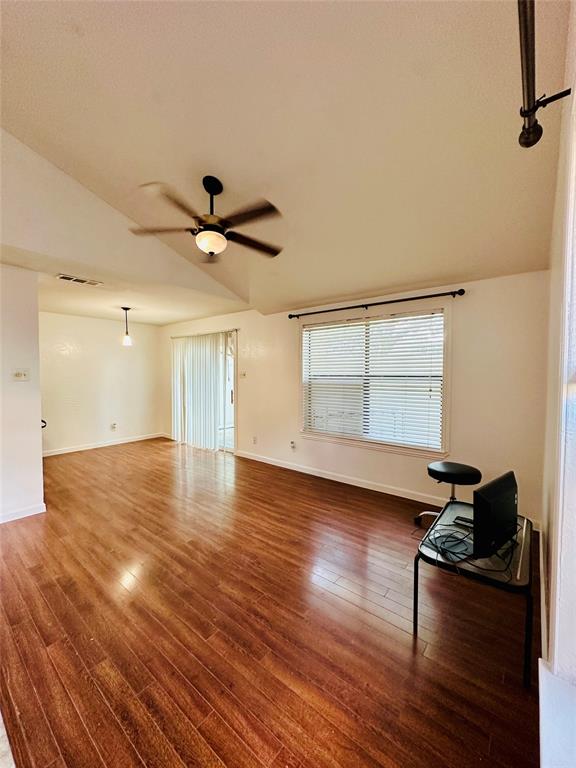 2240 Tarpley Road, Unit 234 Carrollton, TX 75006 - Photo 3 of 13 a view of workspace with wooden floor and ceiling fan