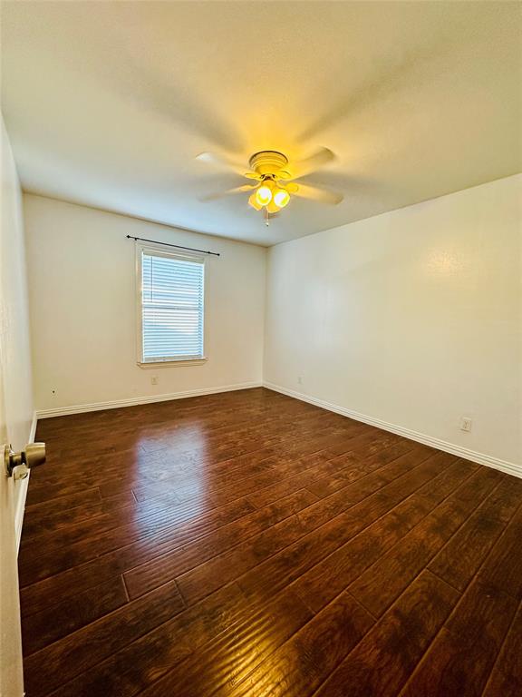 2240 Tarpley Road, Unit 234 Carrollton, TX 75006 - Photo 6 of 13 an empty room with wooden floor and windows