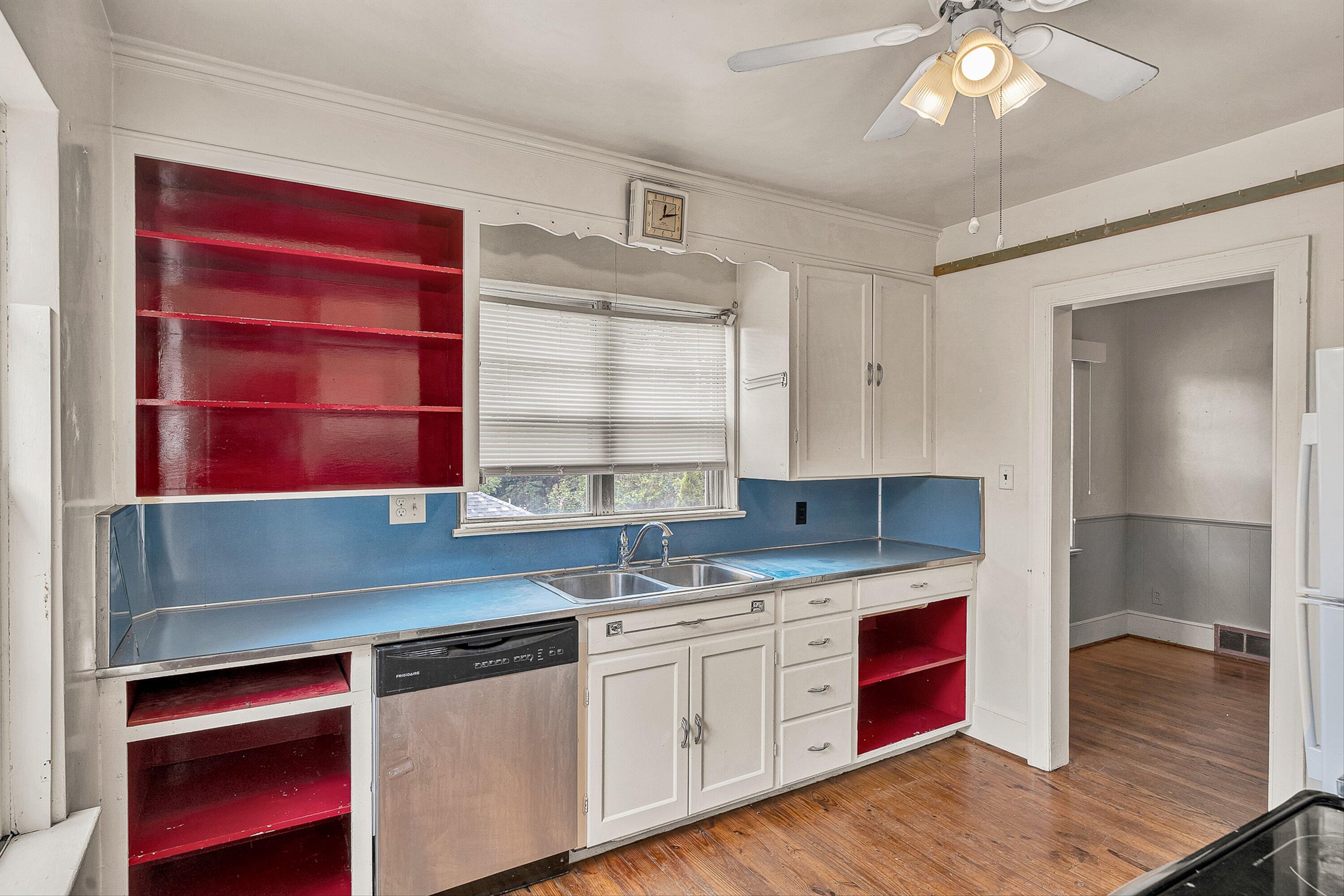 1917 Langdon Road Southwest Roanoke, VA 24015 - Photo 14 of 42 a kitchen with a sink cabinets and window