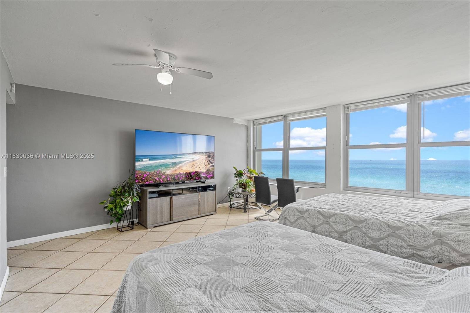 2899 Collins Avenue, Unit 931 Miami Beach, FL 33140 - Photo 1 of 28 a large bedroom with a bed and large window with balcony view