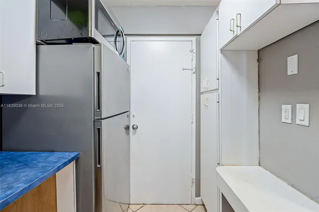 a kitchen with sink a stove and cabinets
