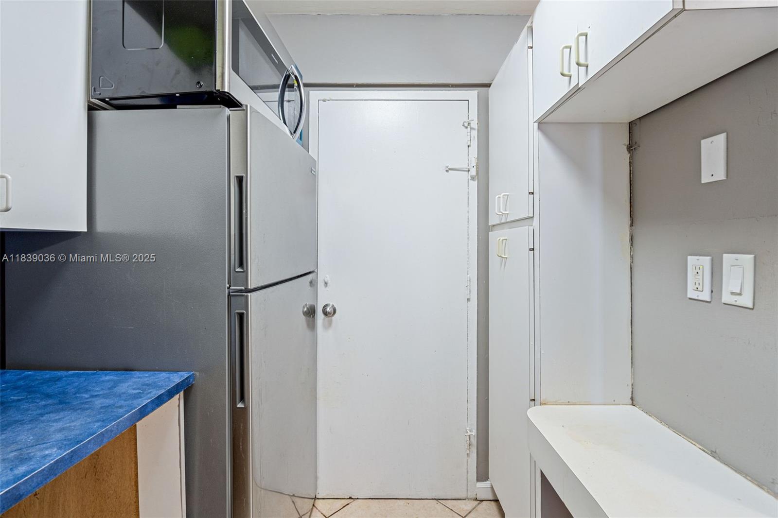 2899 Collins Avenue, Unit 931 Miami Beach, FL 33140 - Photo 14 of 28 a bathroom with a granite countertop sink and shower