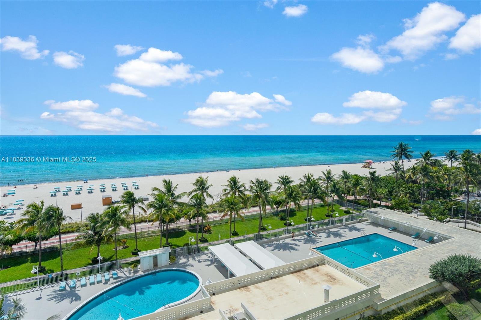 2899 Collins Avenue, Unit 931 Miami Beach, FL 33140 - Photo 2 of 28 a view of a swimming pool with an outdoor seating and a garden