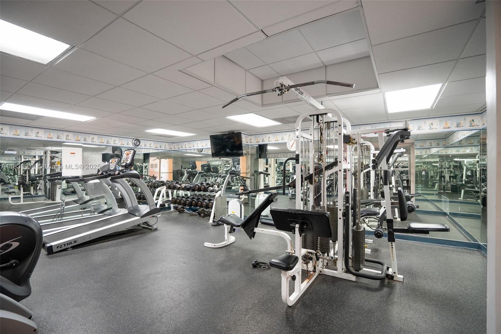 2899 Collins Avenue, Unit 931 Miami Beach, FL 33140 - Photo 21 of 28 a view of a room with gym equipment