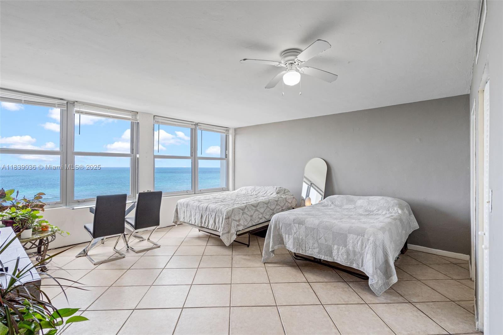 2899 Collins Avenue, Unit 931 Miami Beach, FL 33140 - Photo 5 of 28 a bedroom with a bed and a window