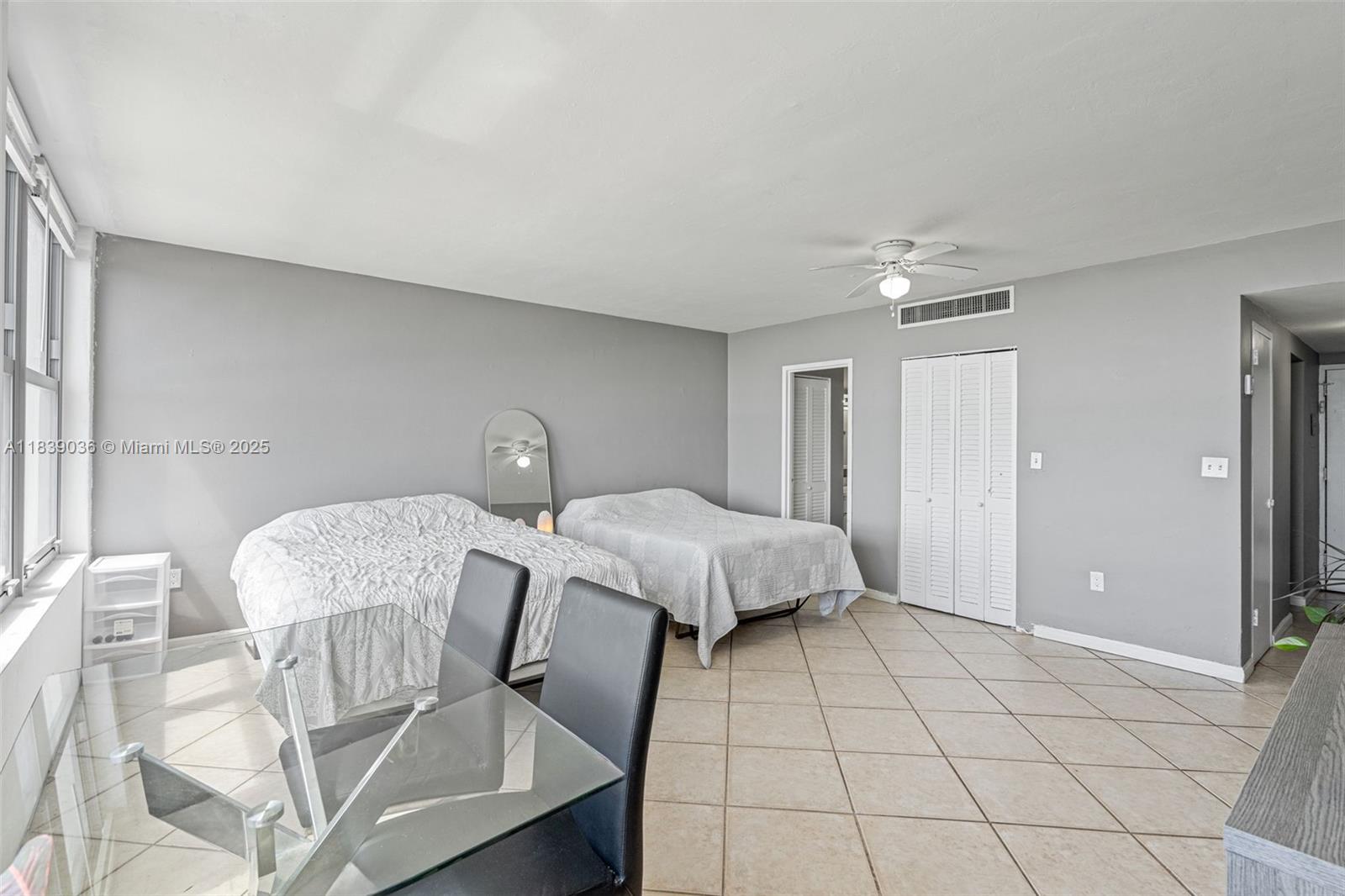 2899 Collins Avenue, Unit 931 Miami Beach, FL 33140 - Photo 7 of 28 a bed room with a bed and chair