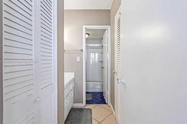 a bathroom with a vanity and a shower