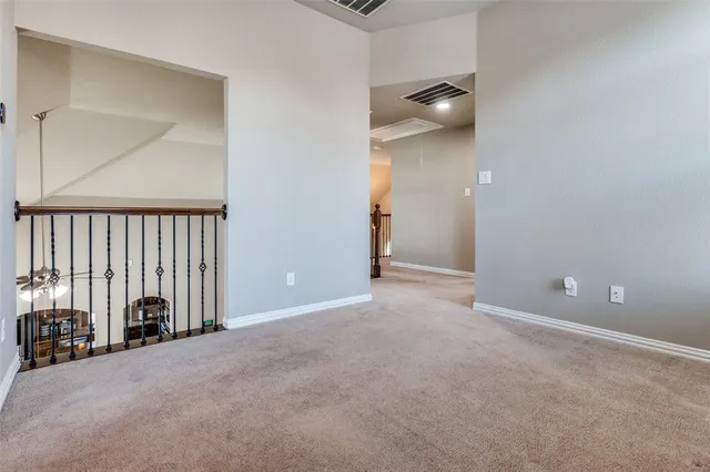 a view of a livingroom with entryway and hall way