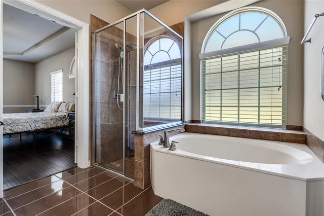 a white bath tub sitting next to a window