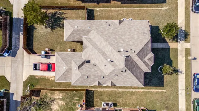 an aerial view of residential houses with outdoor space