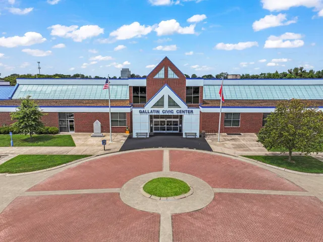 a view of a house with pool and yard