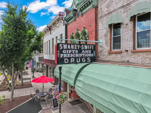 a view of a street with sitting area