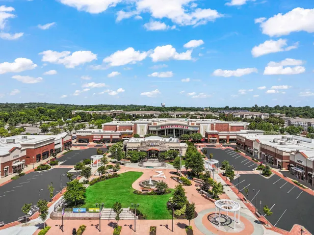 a view of a street with a building in the background