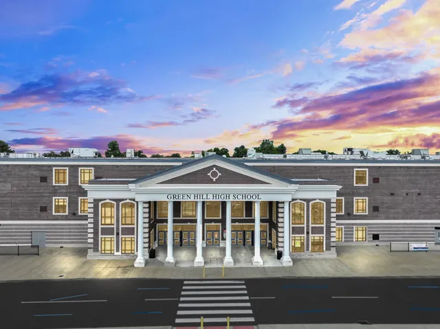 a sign that is on the side of the tree