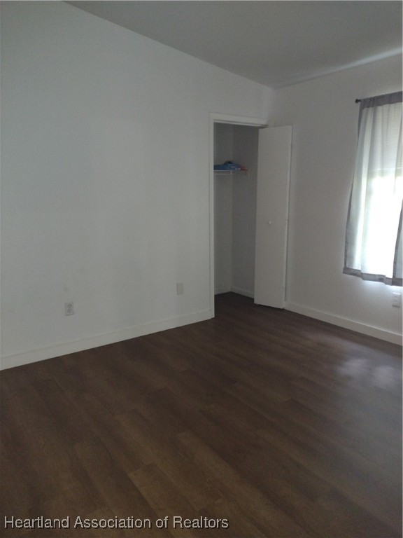 1731 West Batavia Road Avon Park, FL 33825 - Photo 13 of 25 an empty room with wooden floor and windows