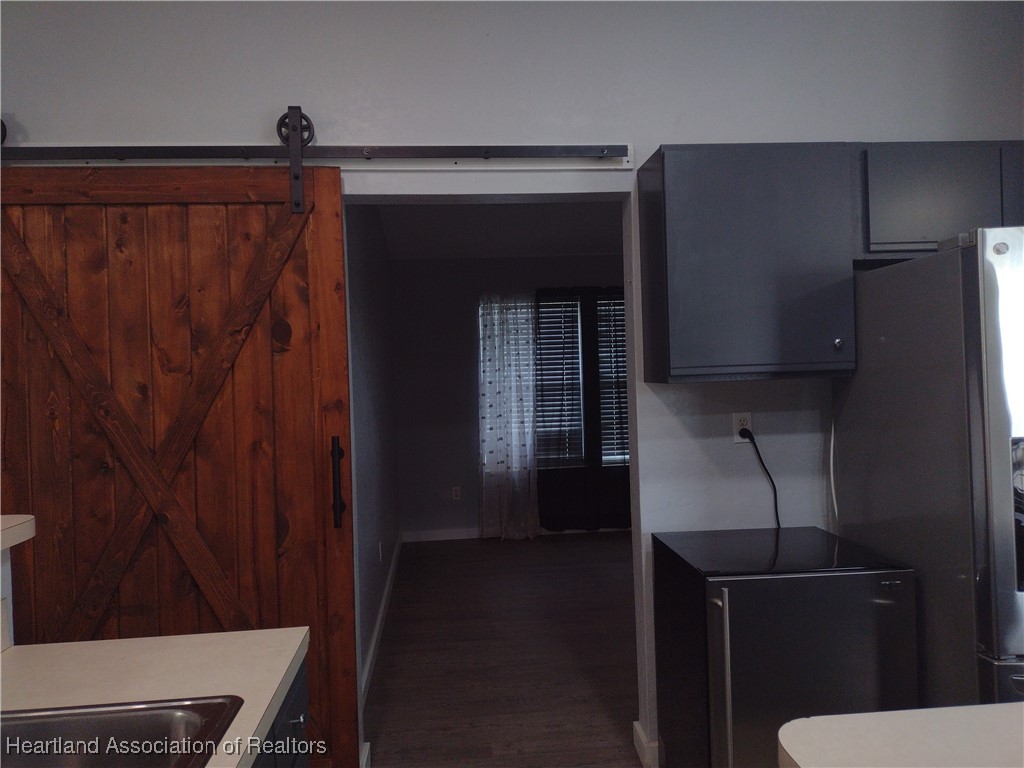 1731 West Batavia Road Avon Park, FL 33825 - Photo 23 of 25 a view of kitchen with wooden floor and cabinets