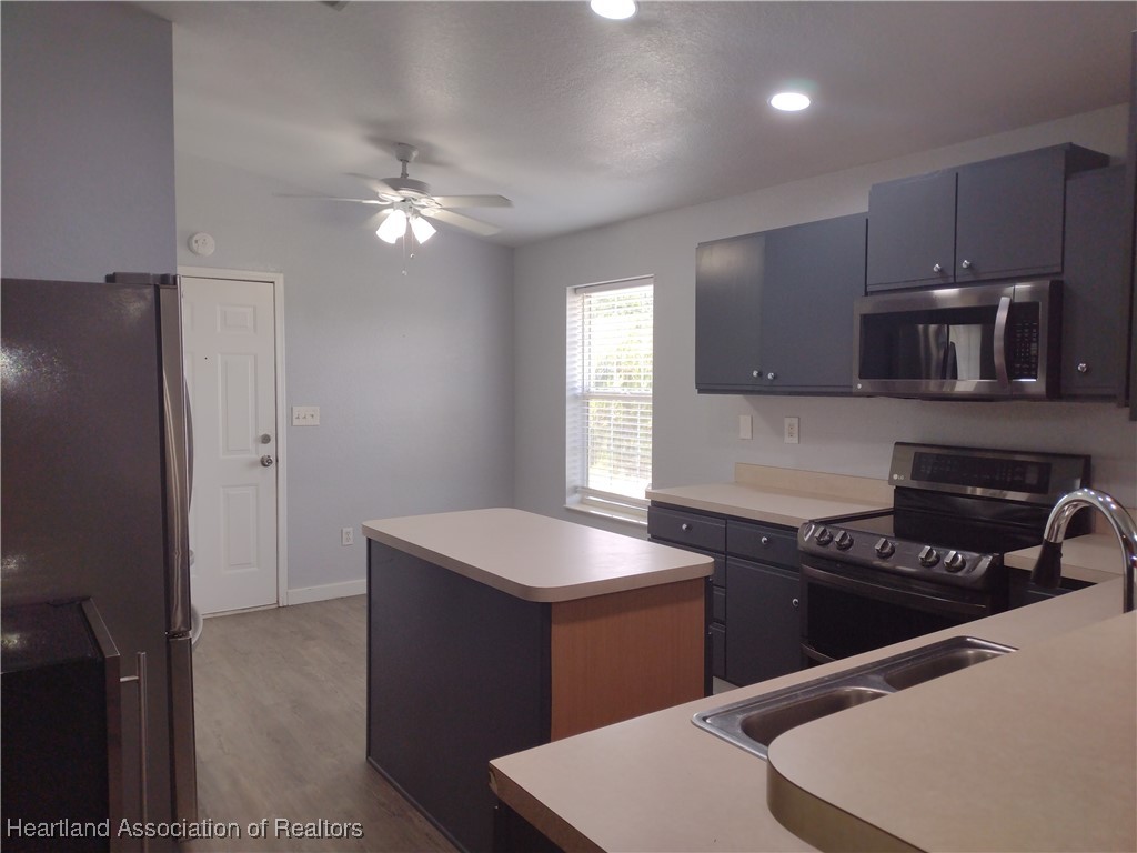 1731 West Batavia Road Avon Park, FL 33825 - Photo 25 of 25 a kitchen that has a sink and a stove in it