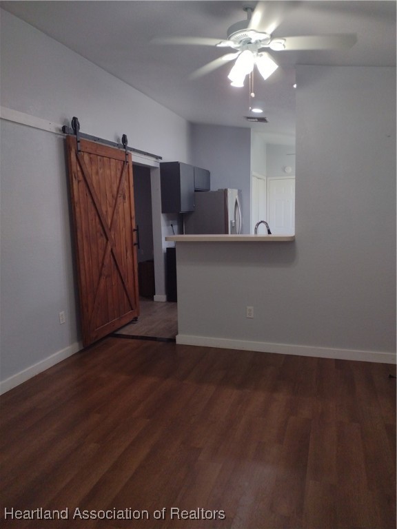 1731 West Batavia Road Avon Park, FL 33825 - Photo 4 of 25 wooden floor in an empty room with a window