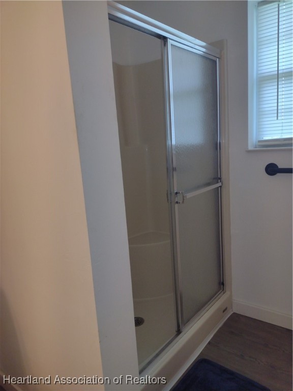 1731 West Batavia Road Avon Park, FL 33825 - Photo 9 of 25 a bathroom with a glass shower door