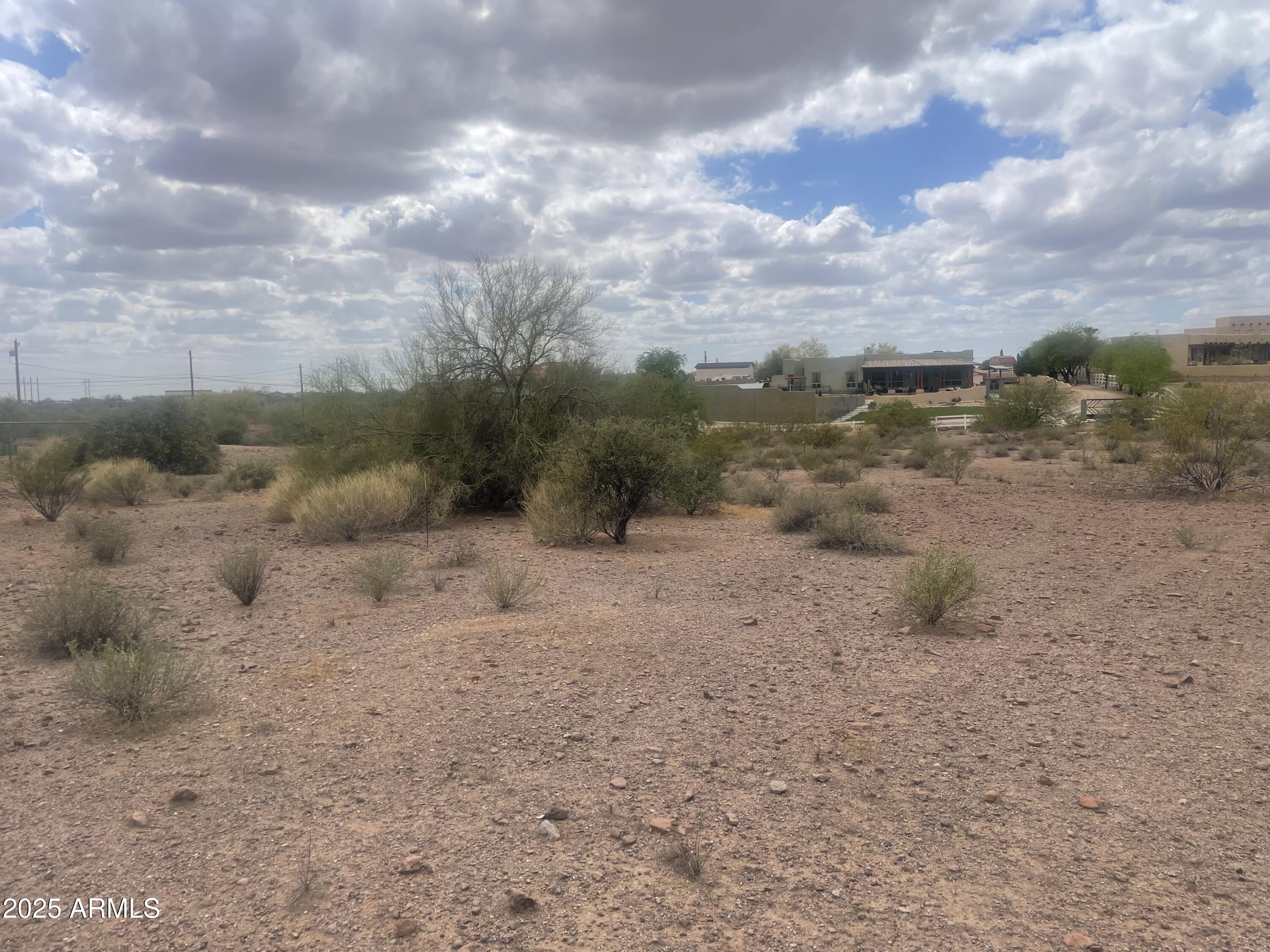 0 South Roadrunner Road Apache Junction, AZ 85119 - Photo 4 of 7 a view of a dry yard with wooden fence