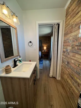 a en suite bathroom with a sink and a mirror