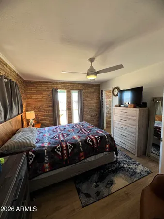 a bed sitting in a bedroom next to a window