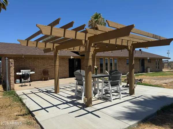 a front view of a building with sitting area